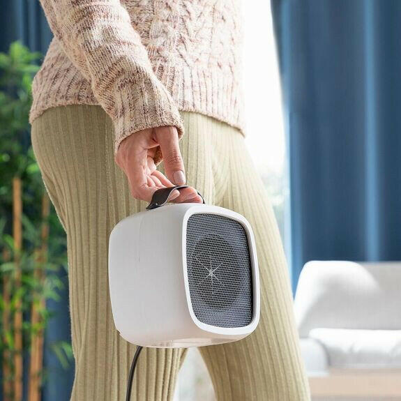 Radiateur portable Innovagoods  - Radiateur d'appoint transportable
    optimisé pour une chaleur instantanée et efficace.